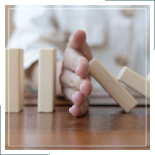 hand stopping falling blocks